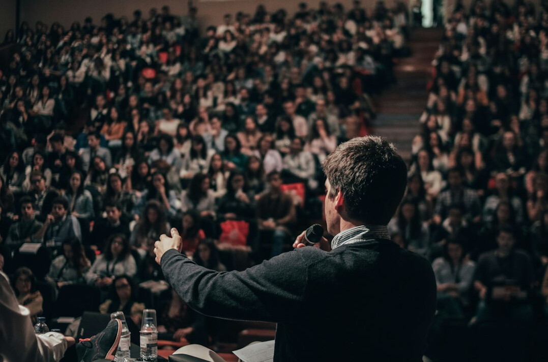 confident speaker on stage