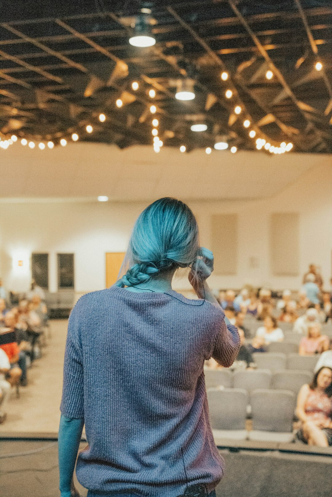 confident speaker on stage